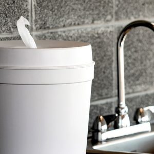 wipes dispenser next to a sink and faucet