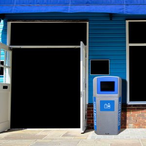 large waste bin recycling bin in front of a store